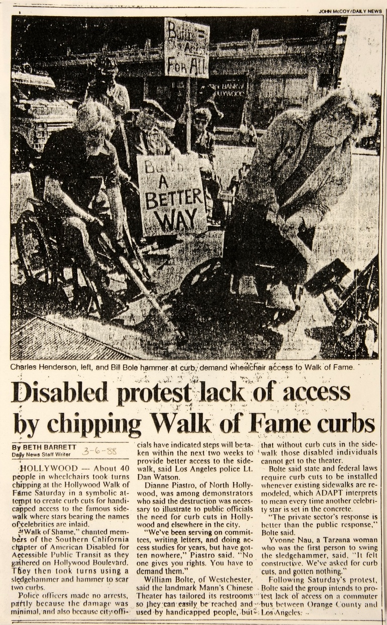 Newspaper clipping from 1988 picturing disability right activists in Los Angeles smashing curbs with sledgehammers.